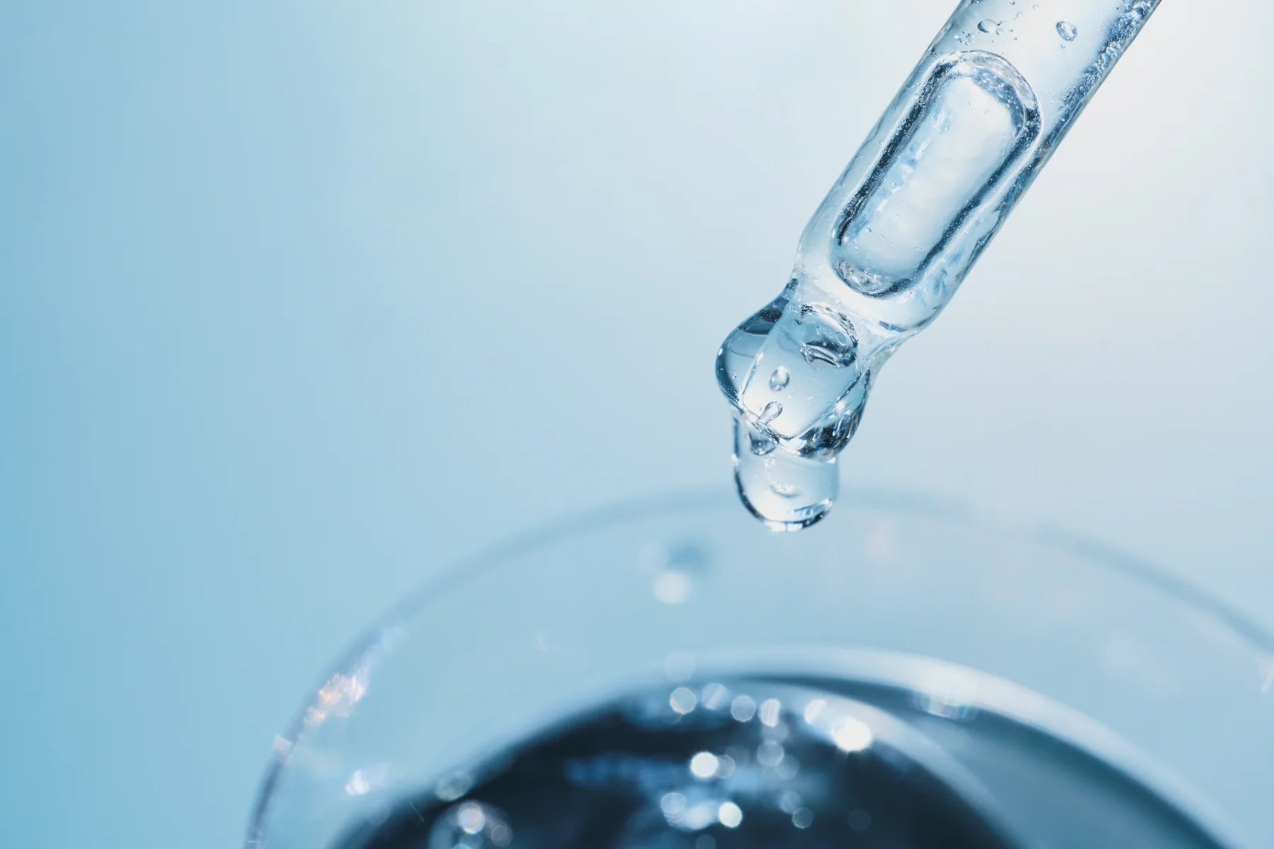 Pipette dispensing a drop of liquid