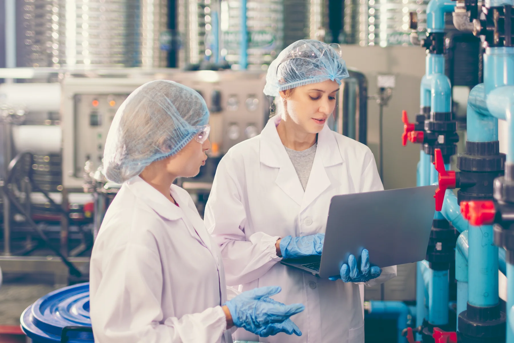 Laboratory technicians in an industrial facility