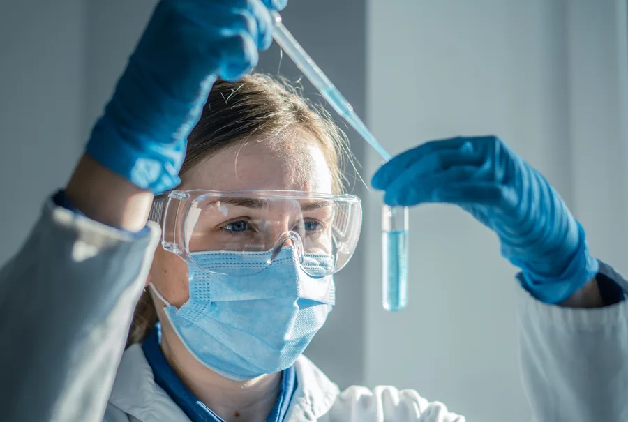 Researcher handling a sample