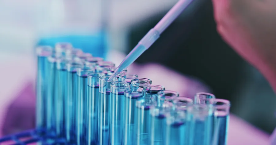Pipette and test tubes in a laboratory